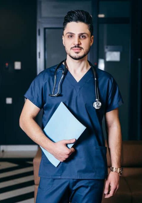 Doctor standing in room Doctor standing in room